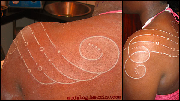 white ink tattoos on brown skin