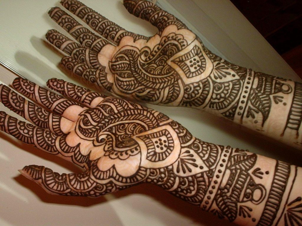 Henna temporary tattoo design on arms