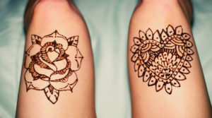 henna art of roses on leg