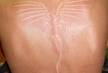 White ink wings tattoo whole back