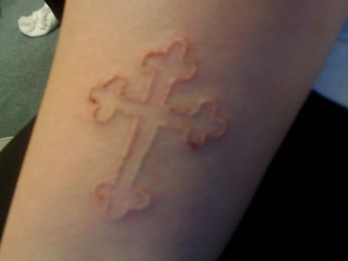 white-ink-cross-tattoo