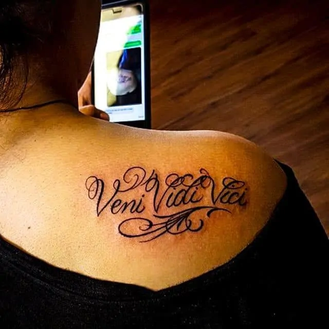 Girl veni vidi vici tattoo on shoulder design