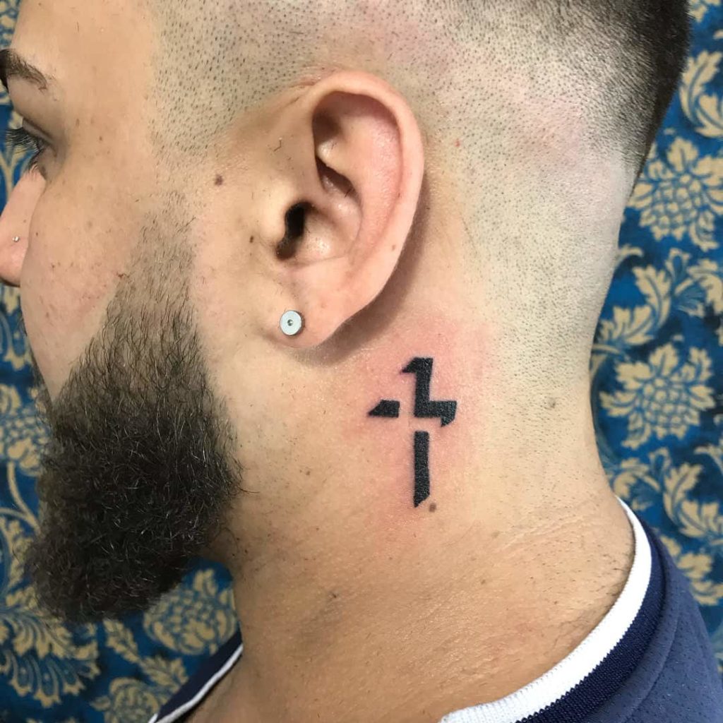 behind the ear cross tattoo