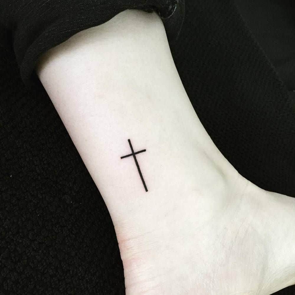 small cross leg tattoo